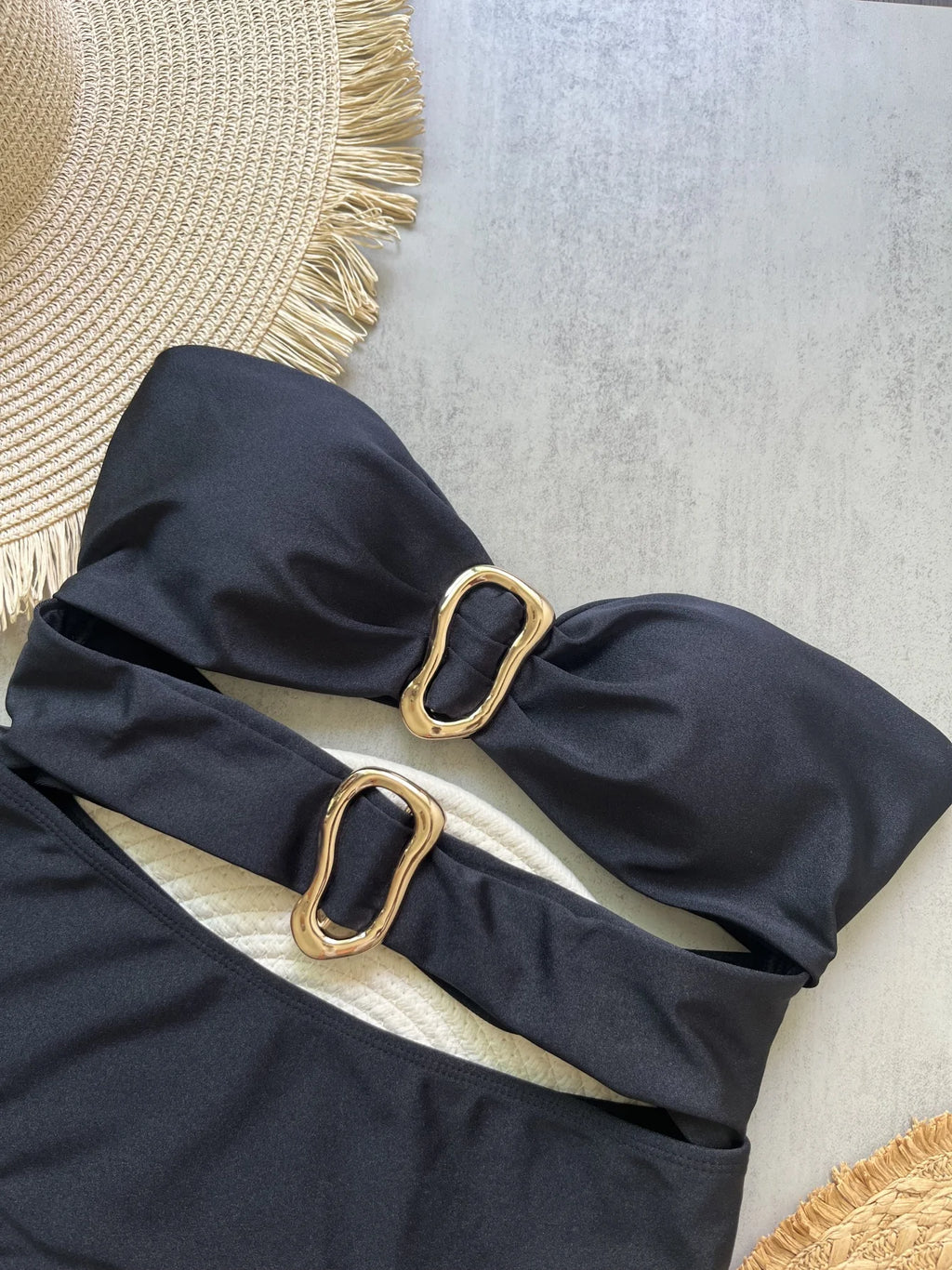Sexy women's swimsuit in three colors, with an attractive metal ring design.
