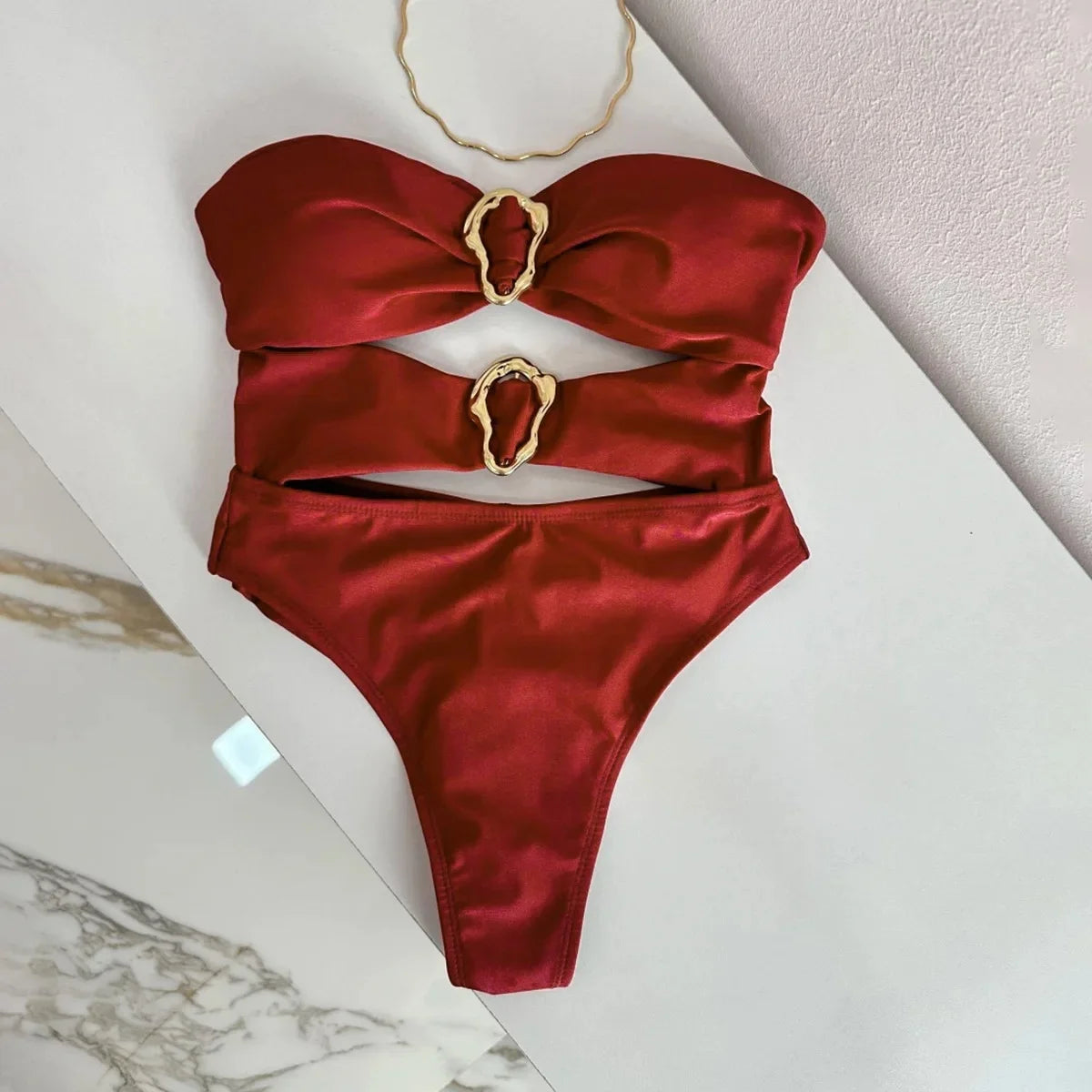 Sexy women's swimsuit in three colors, with an attractive metal ring design.