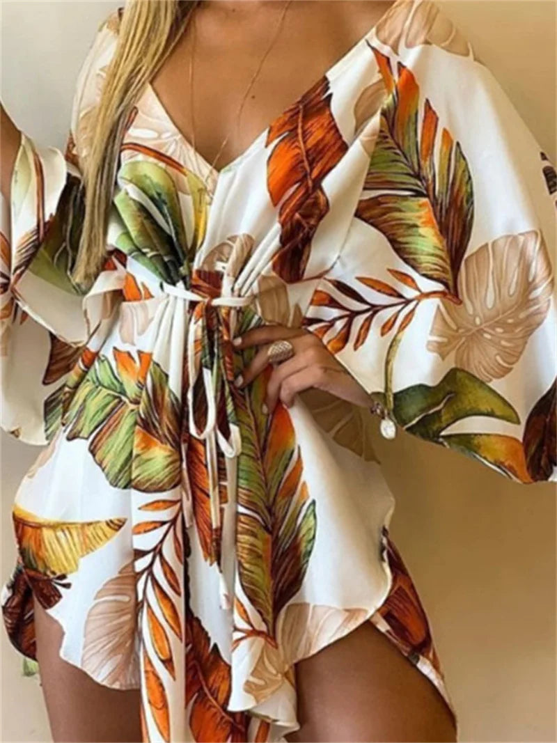 Sexy printed women's dress with a V-neck, wide sleeves, ruffles, and a loose, short floral print, perfect for summer vacations.