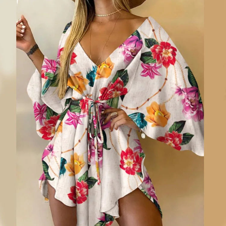 Sexy printed women's dress with a V-neck, wide sleeves, ruffles, and a loose, short floral print, perfect for summer vacations.