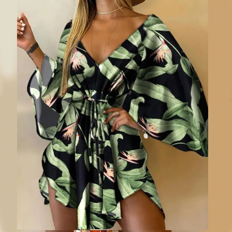 Sexy printed women's dress with a V-neck, wide sleeves, ruffles, and a loose, short floral print, perfect for summer vacations.