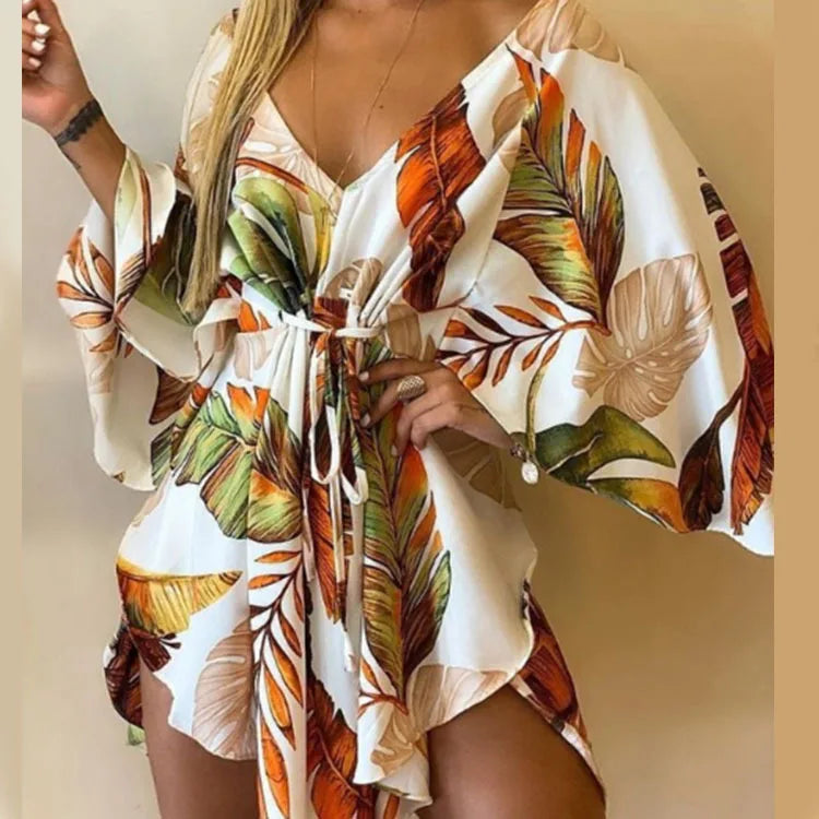 Sexy printed women's dress with a V-neck, wide sleeves, ruffles, and a loose, short floral print, perfect for summer vacations.