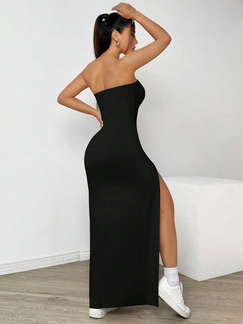 Elegant long strapless dress, with a side slit, in a simple solid color.