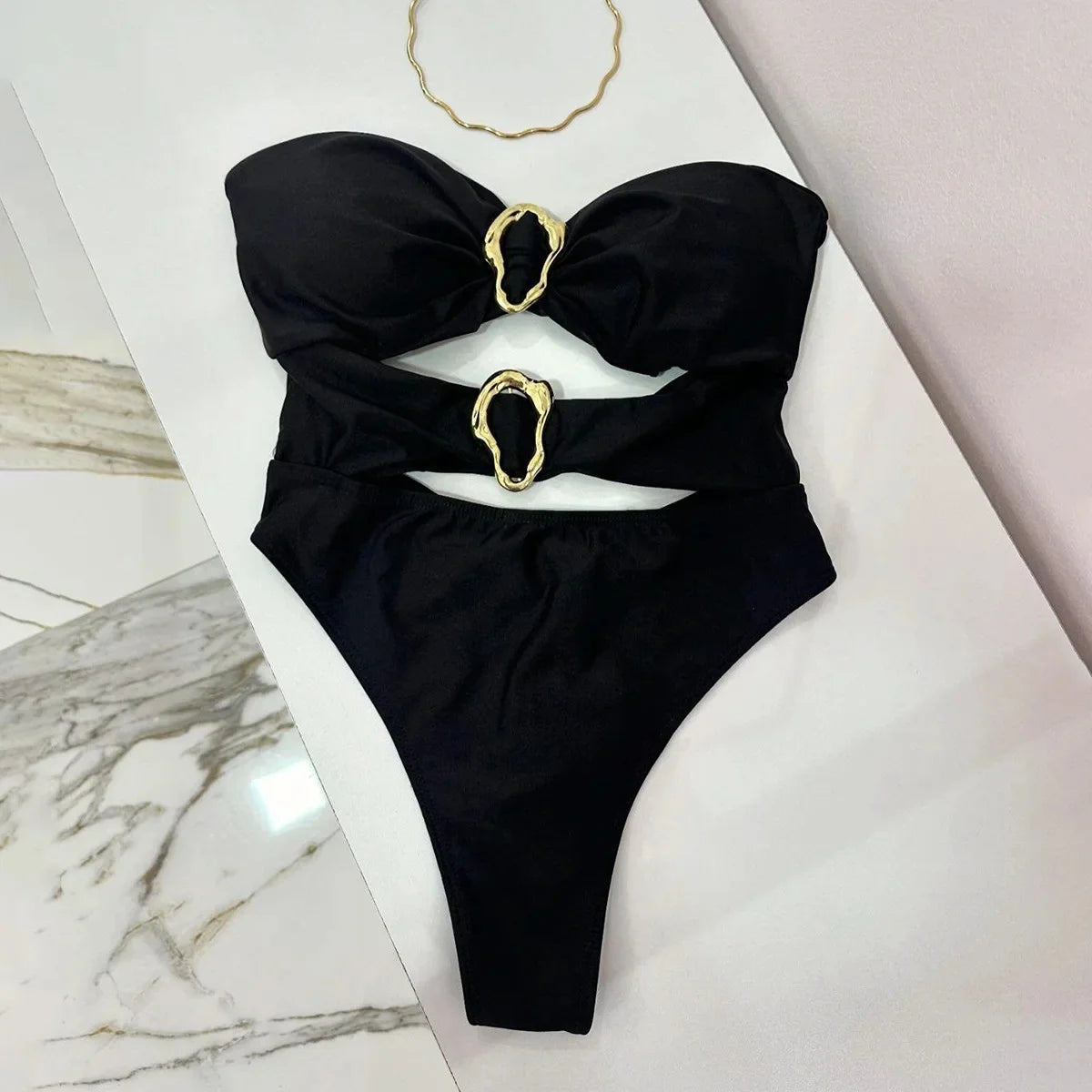 Sexy women's swimsuit in three colors, with an attractive metal ring design.
