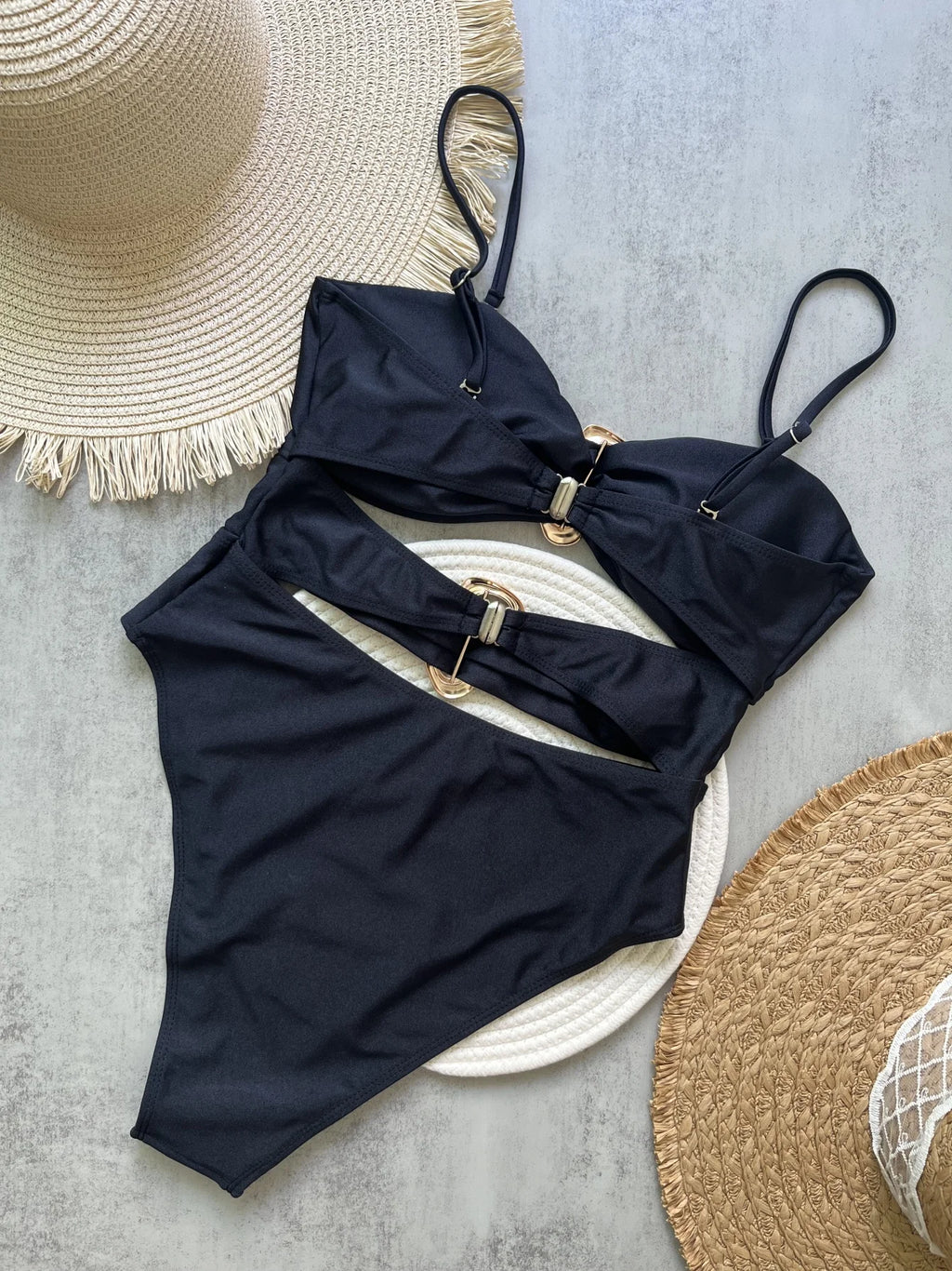 Sexy women's swimsuit in three colors, with an attractive metal ring design.
