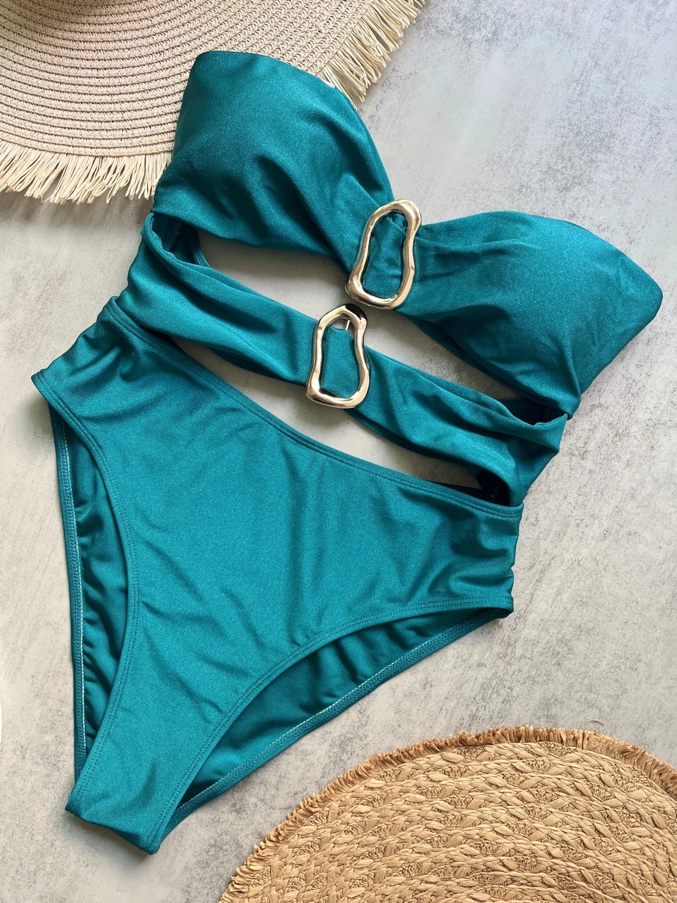 Sexy women's swimsuit in three colors, with an attractive metal ring design.