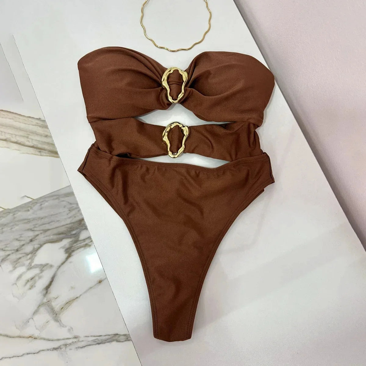 Sexy women's swimsuit in three colors, with an attractive metal ring design.