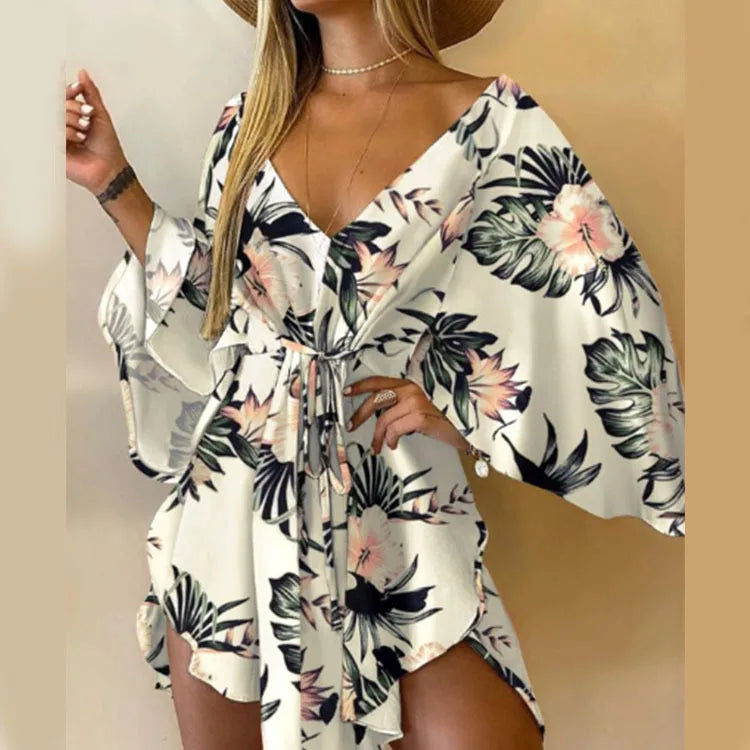 Sexy printed women's dress with a V-neck, wide sleeves, ruffles, and a loose, short floral print, perfect for summer vacations.