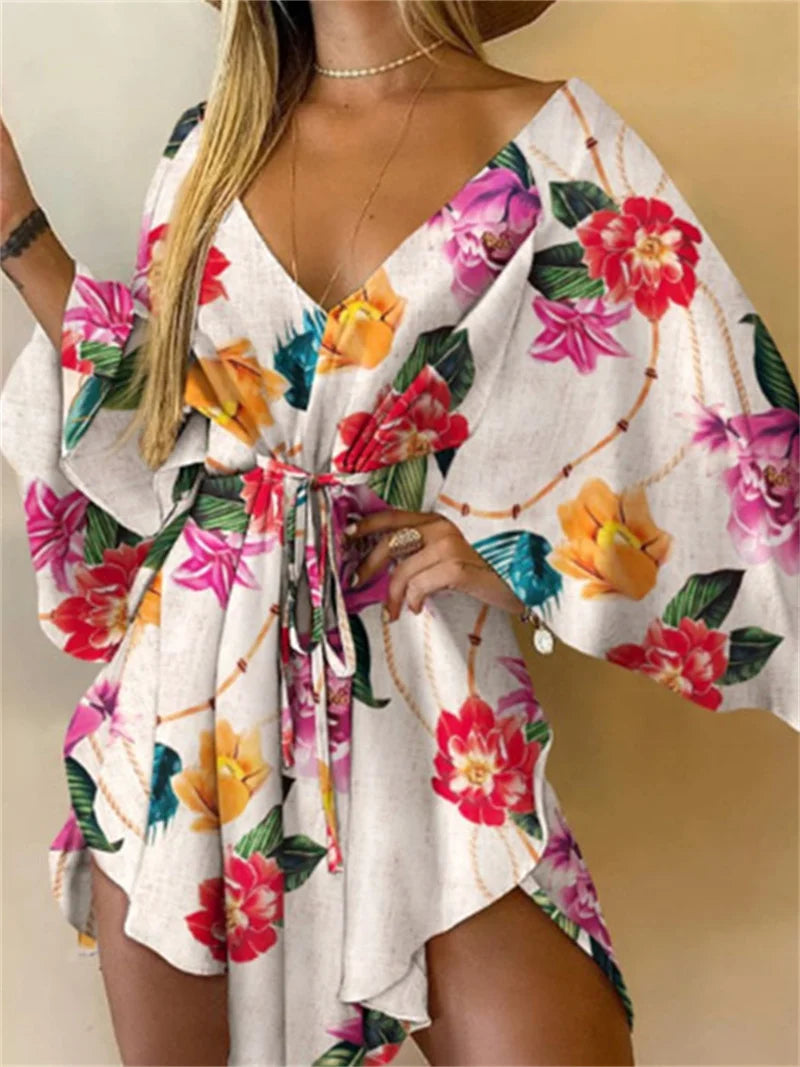 Sexy printed women's dress with a V-neck, wide sleeves, ruffles, and a loose, short floral print, perfect for summer vacations.