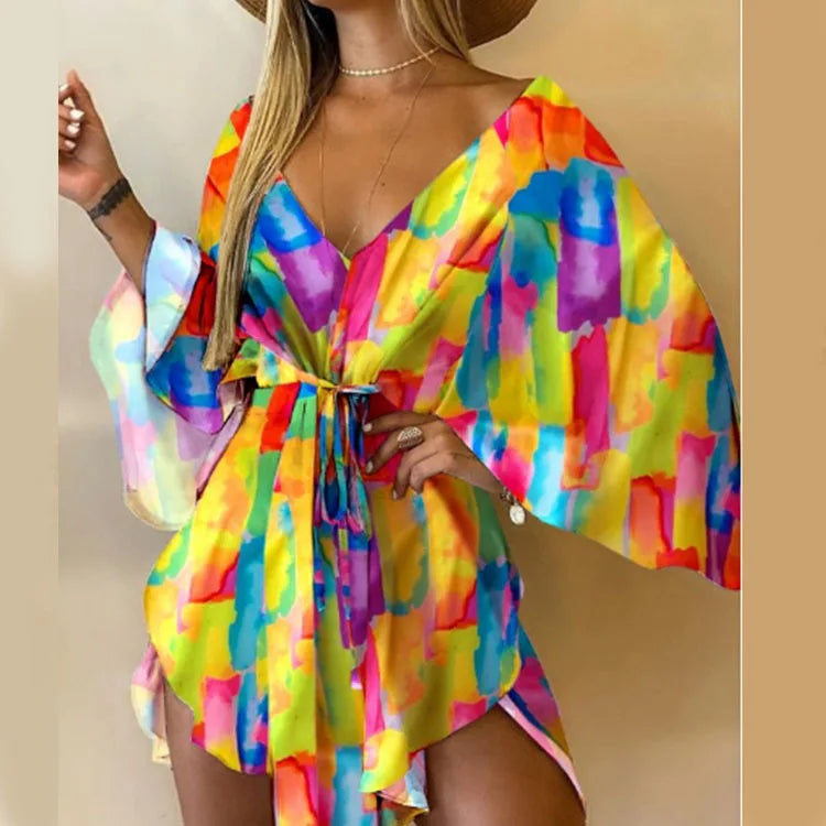 Sexy printed women's dress with a V-neck, wide sleeves, ruffles, and a loose, short floral print, perfect for summer vacations.