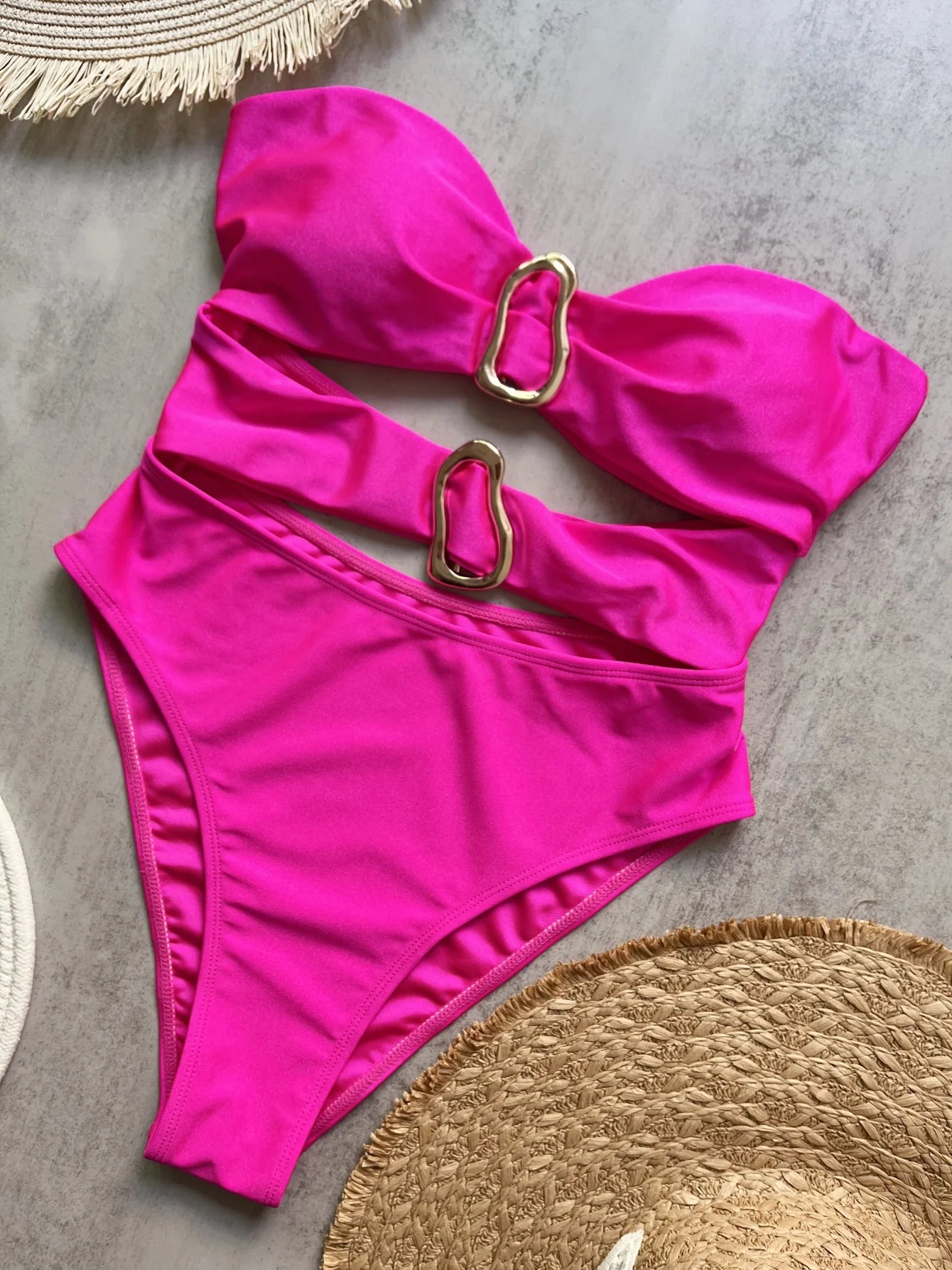 Sexy women's swimsuit in three colors, with an attractive metal ring design.