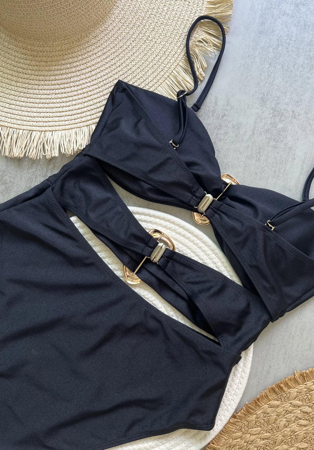 Sexy women's swimsuit in three colors, with an attractive metal ring design.