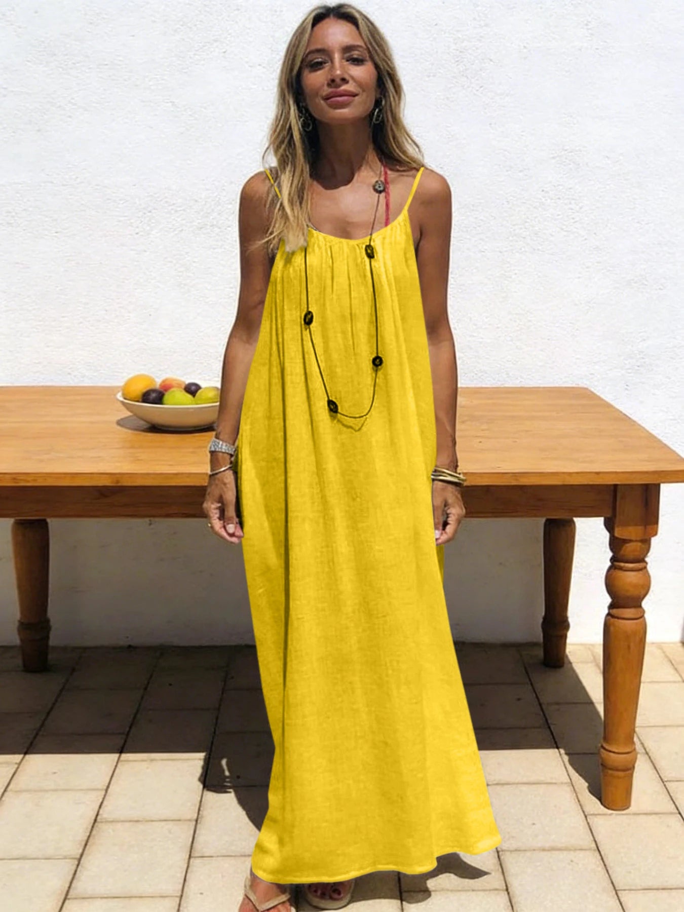 Long, loose-fitting house dress without straps or back, comfortable for sleeping