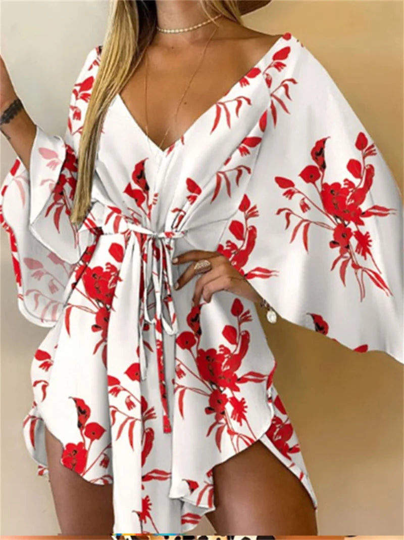 Sexy printed women's dress with a V-neck, wide sleeves, ruffles, and a loose, short floral print, perfect for summer vacations.