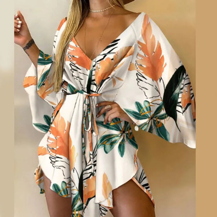 Sexy printed women's dress with a V-neck, wide sleeves, ruffles, and a loose, short floral print, perfect for summer vacations.